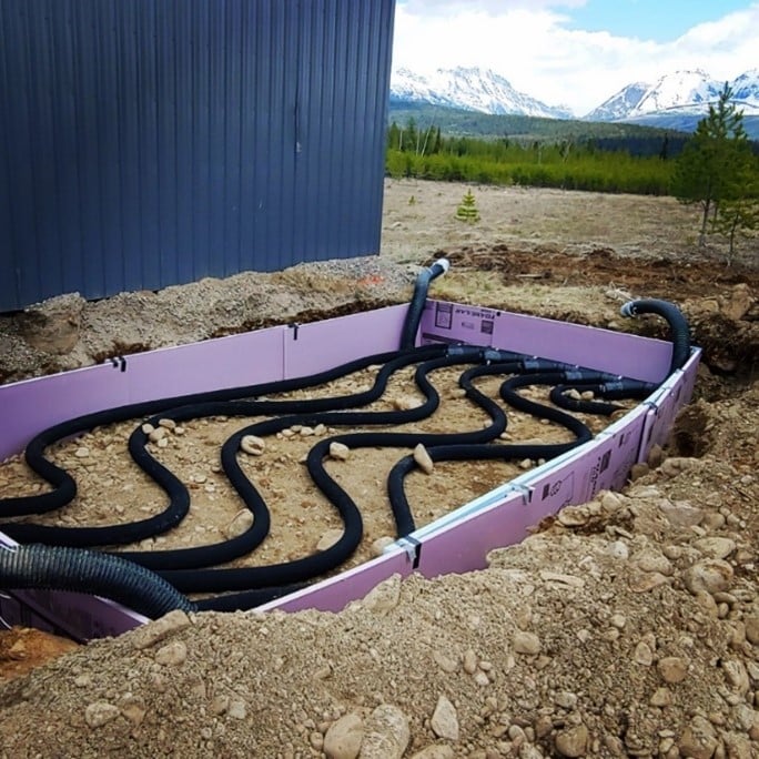 The two-foot layer of perforated piping and insulation in a passive system. 