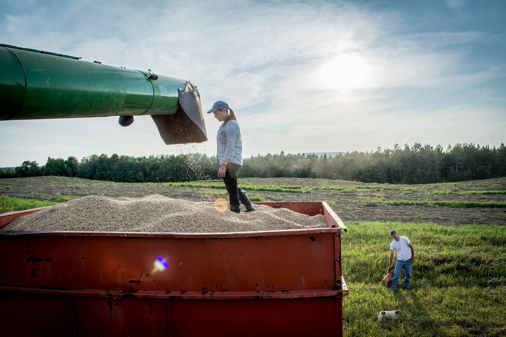 Sara Williams Flewelling, Aurora Mills and Farm standing in grain bin