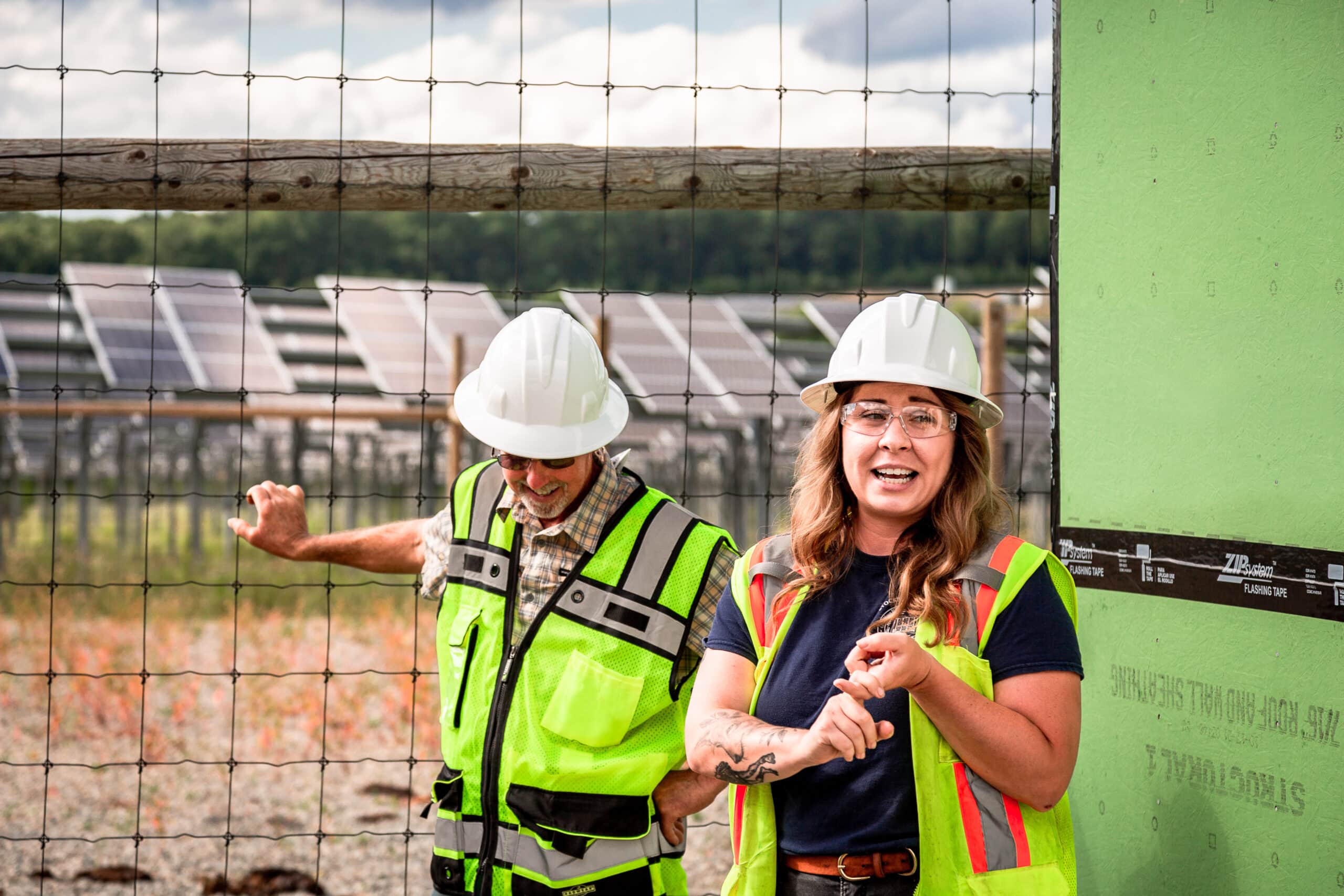 Energy engineers talking about solar panels