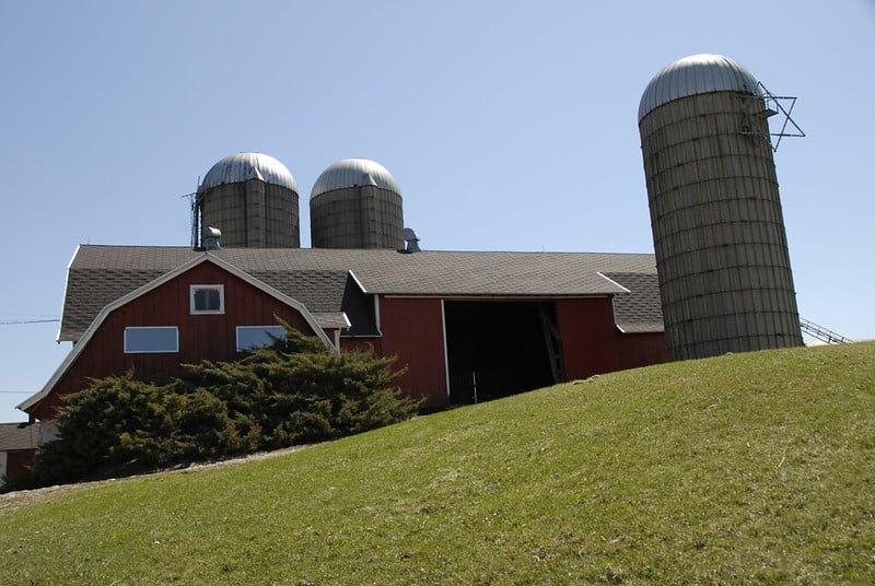 barn and silos on a hill