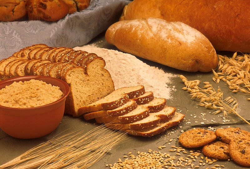 loaves of bread, grain, and flour