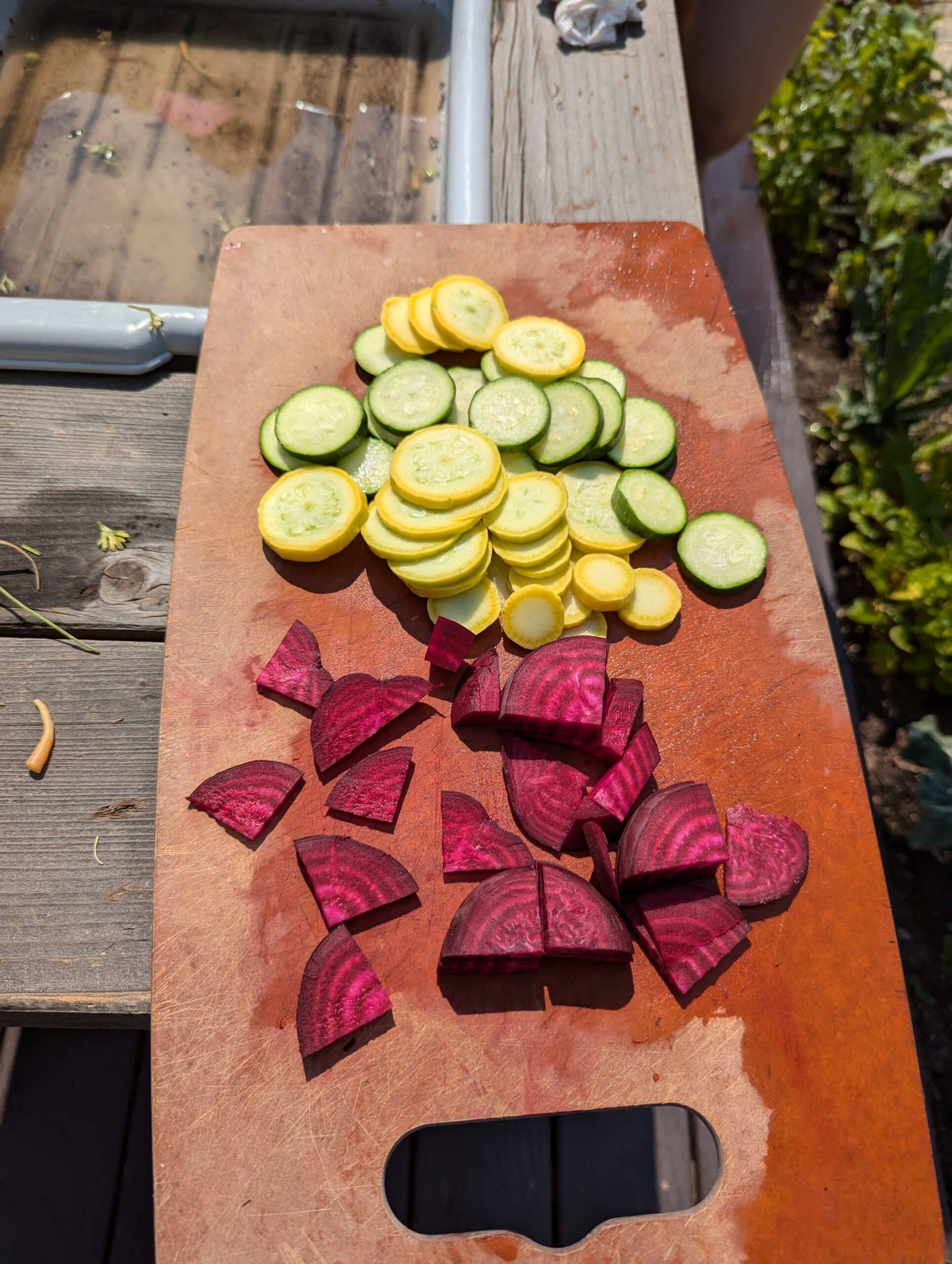 sliced squash and beets on a cutting board